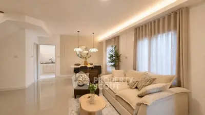Elegant living room with cozy sofa and modern decor in a bright open layout.
