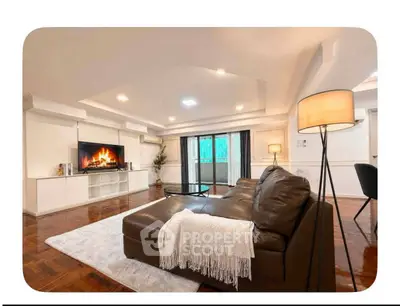 Spacious living room with modern decor, cozy fireplace, and elegant lighting, perfect for relaxation and entertainment.