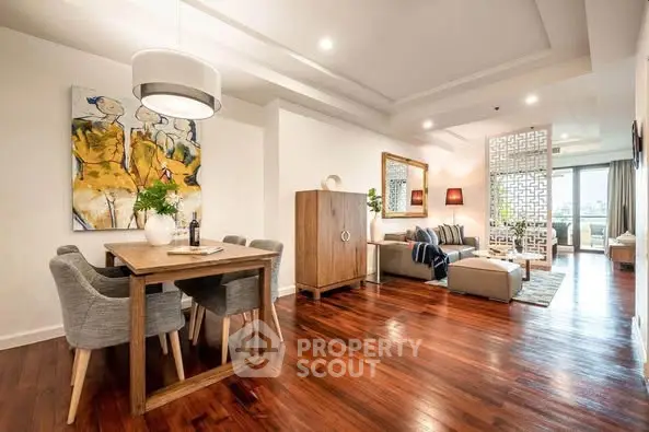 Luxurious open-plan living room with elegant dining area and stylish decor