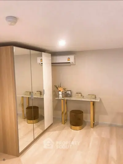 Modern bedroom with mirrored wardrobe and elegant vanity table