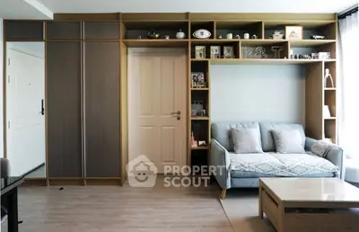 Modern living room with built-in shelving and cozy sofa, perfect for stylish urban living.