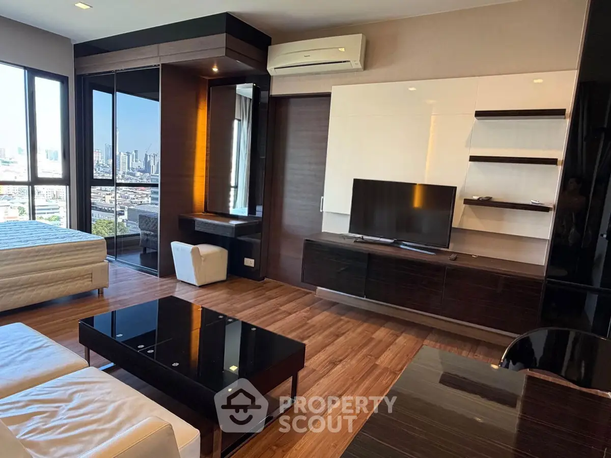 Luxurious modern living room with city view, sleek furniture, and elegant decor in high-rise apartment.