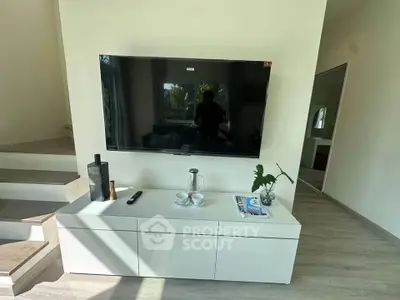 Modern living room with sleek TV setup and stylish decor