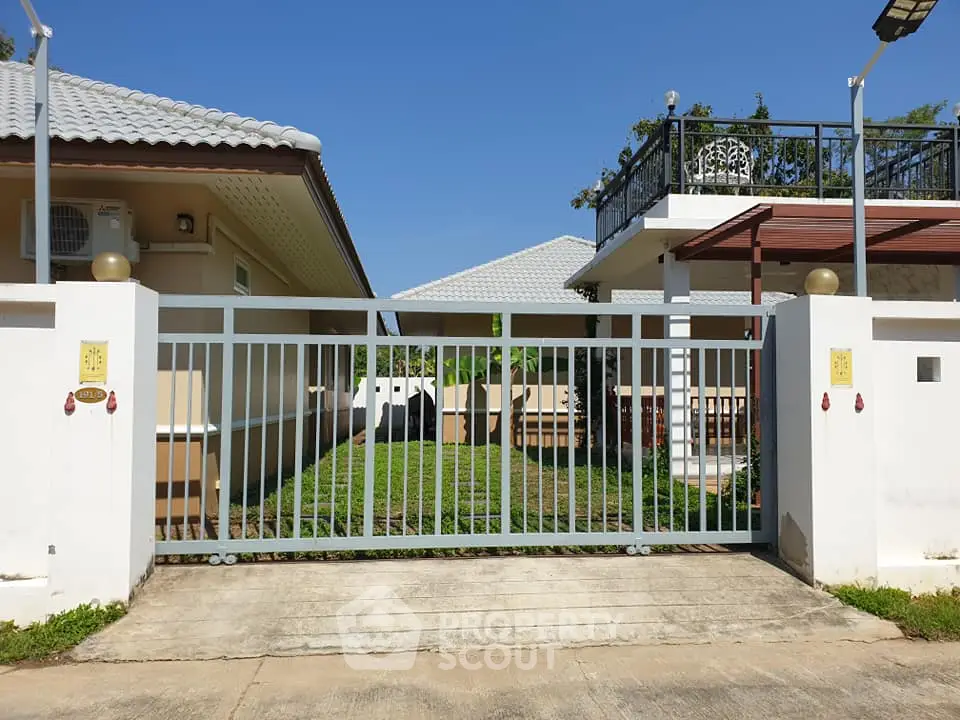 Charming suburban home with gated entrance and spacious yard