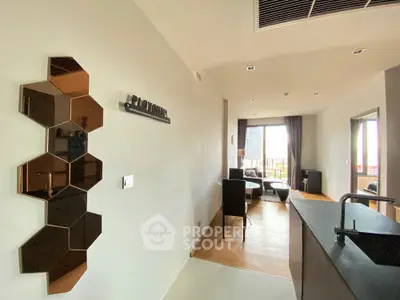 Modern open-layout living room with stylish decor and city view balcony