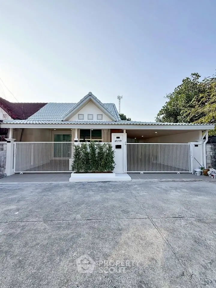 Charming single-story home with gated entrance and spacious driveway, perfect for family living.
