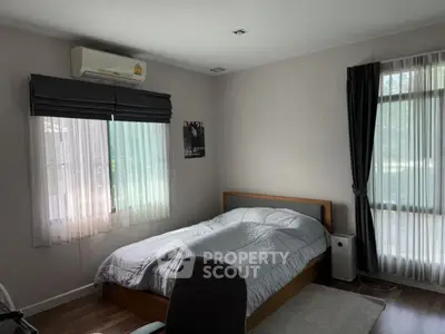 Cozy bedroom with natural light and modern decor