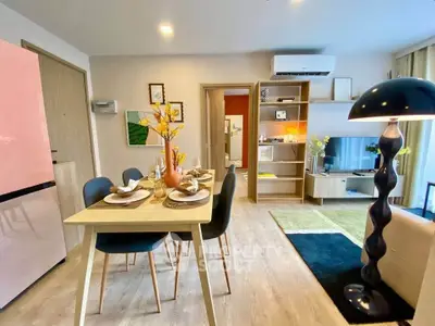Modern living room with stylish dining area and contemporary decor
