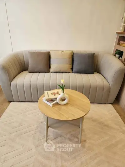 Stylish living room with modern sofa and chic coffee table, perfect for cozy gatherings.