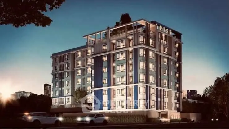 Modern multi-story residential building with sleek design and illuminated windows at dusk.