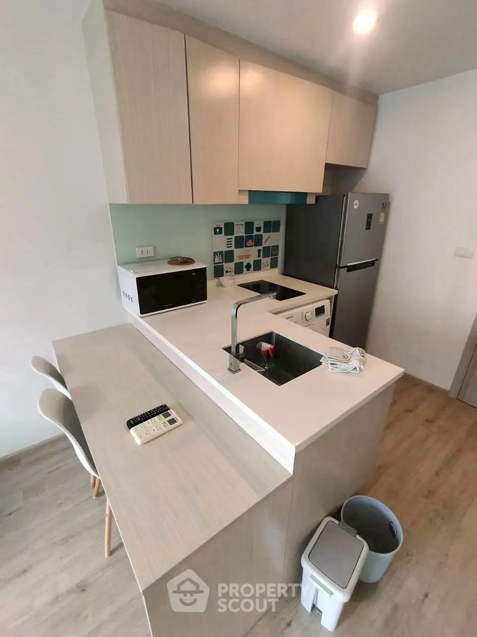 Modern kitchen with sleek design, featuring an open layout and stylish appliances.