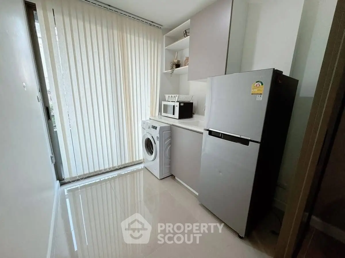 Modern kitchen with sleek appliances and natural light