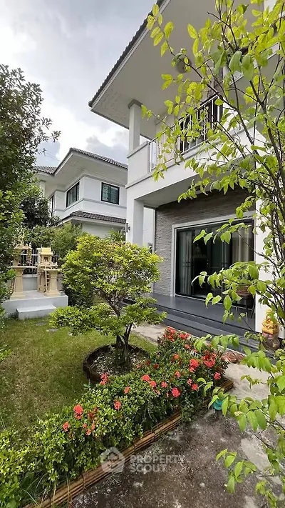 Charming suburban home with lush garden and modern exterior design.
