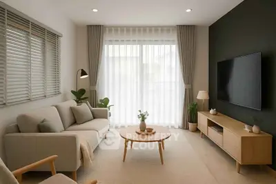 Modern living room with stylish furniture and large window, perfect for relaxation.