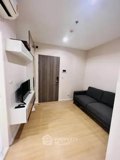 Modern living room with sleek design and cozy sofa in a stylish apartment.