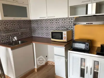 Charming kitchen with colorful backsplash and modern appliances