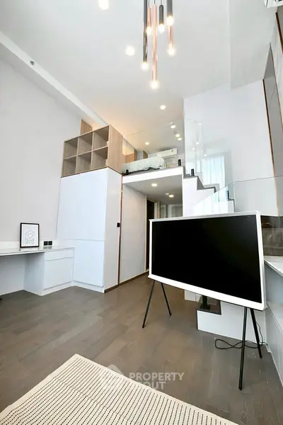 Modern living room with loft design, sleek furniture, and stylish lighting