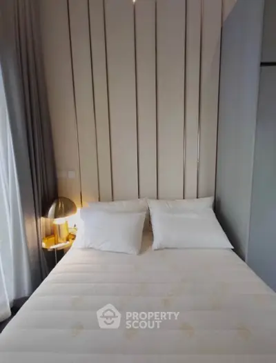 Cozy bedroom with elegant decor and soft lighting, perfect for relaxation.