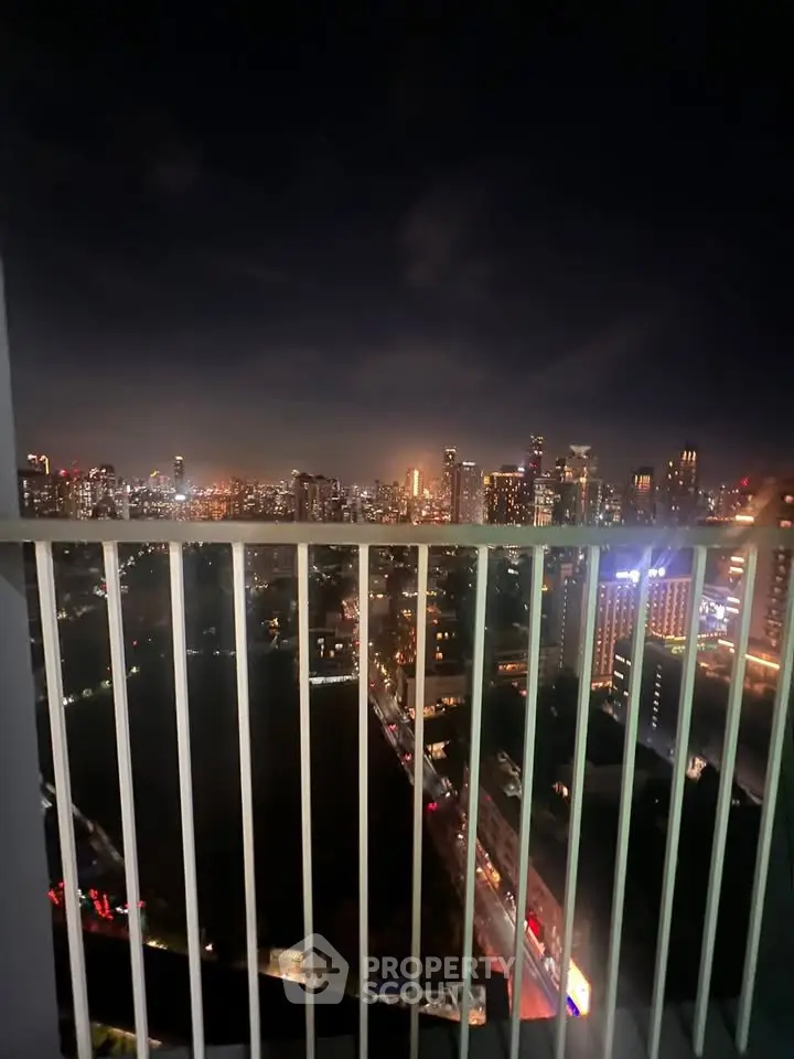 Stunning city skyline view from high-rise balcony at night