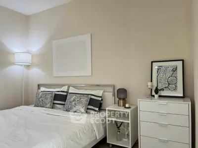 Cozy bedroom with modern decor and stylish furnishings, perfect for relaxation and comfort.