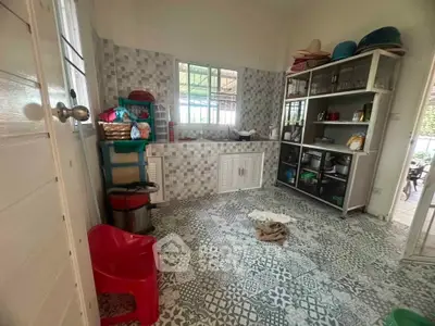 Charming kitchen with unique tile flooring and ample storage space