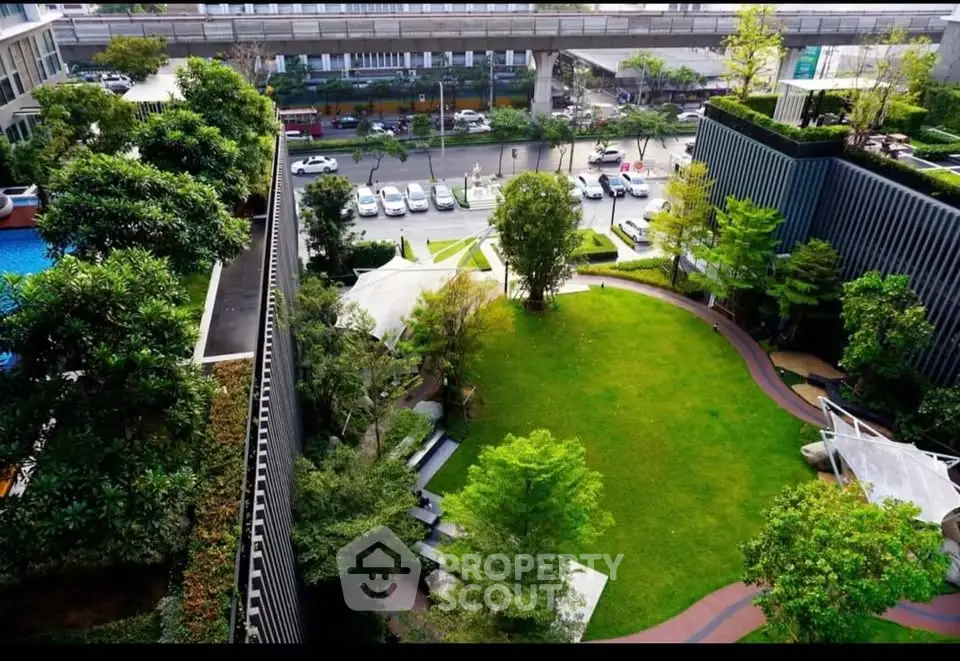 Luxurious urban garden with lush greenery and modern architecture, perfect for relaxation and leisure.