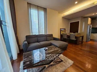 Modern living room with stylish furniture and wooden flooring