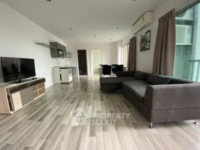 Spacious modern living room with sleek flooring and stylish furnishings