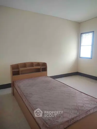 Spacious bedroom with natural light and minimalist design