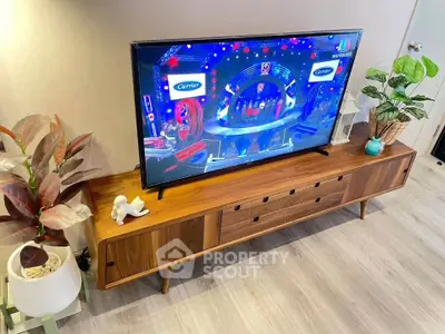 Stylish living room with modern TV stand and decorative plants