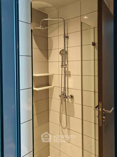 Modern bathroom with sleek shower design and white tiled walls