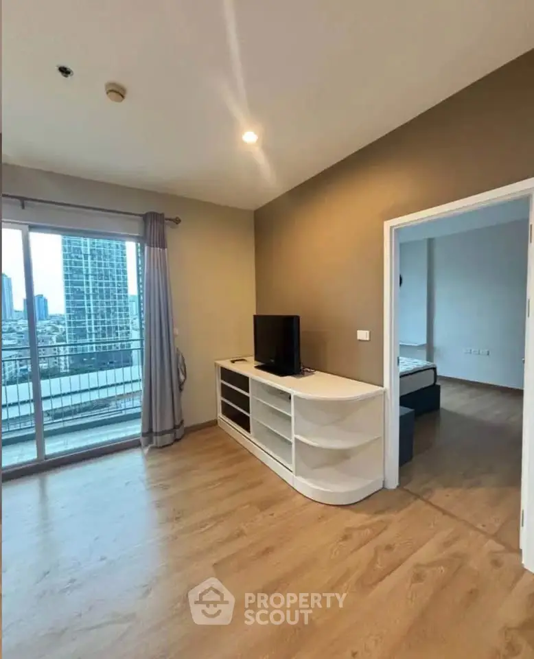 Spacious living room with balcony view in modern apartment