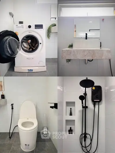 Modern bathroom with washing machine, sleek fixtures, and elegant design.