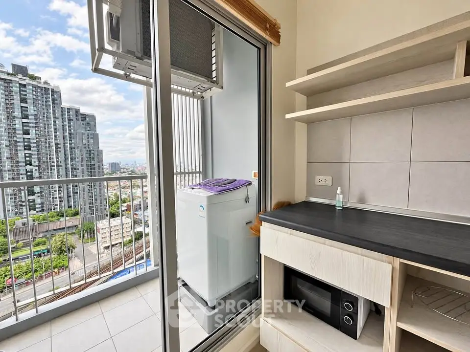 Modern condo balcony with city view and compact kitchen appliances