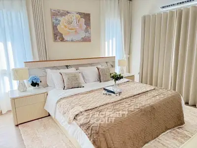 Luxurious bedroom with elegant decor and cozy bedding in a modern home.