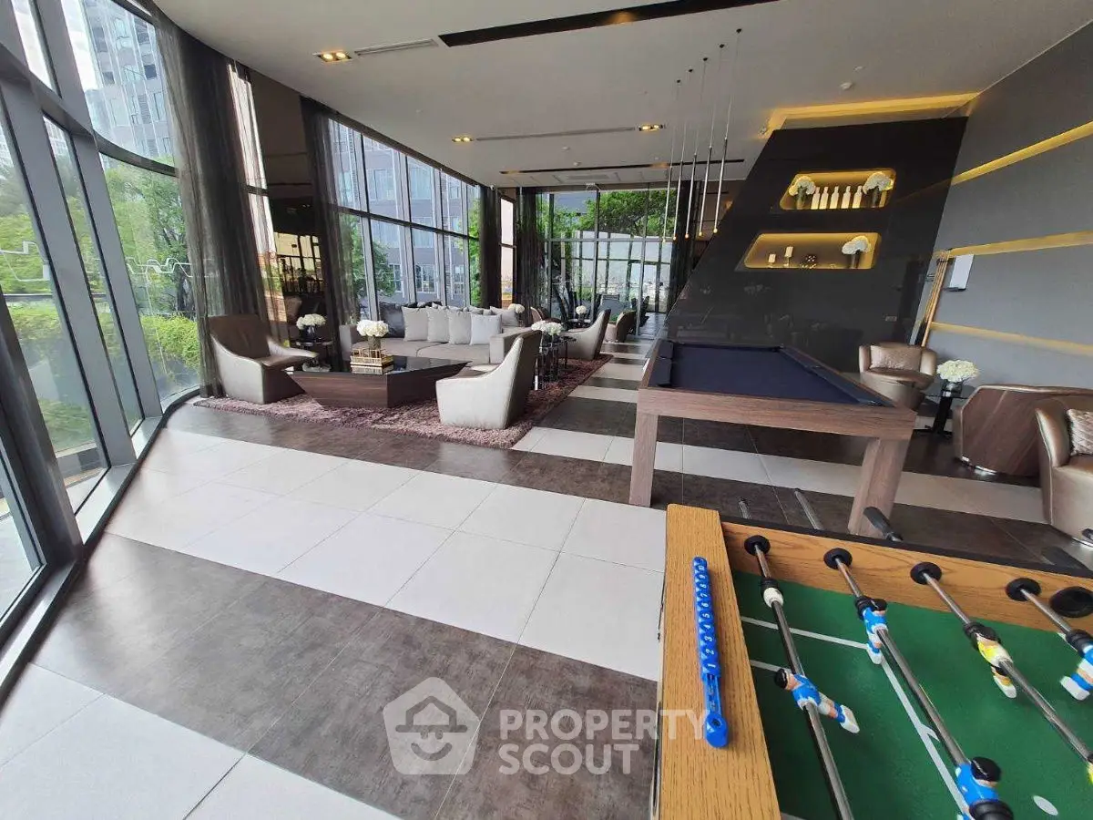 Luxurious modern living room with floor-to-ceiling windows and stylish decor