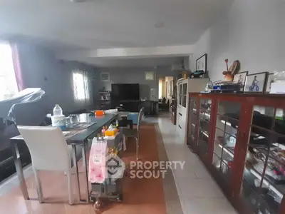 Spacious living room with modern furniture and large windows for natural light.