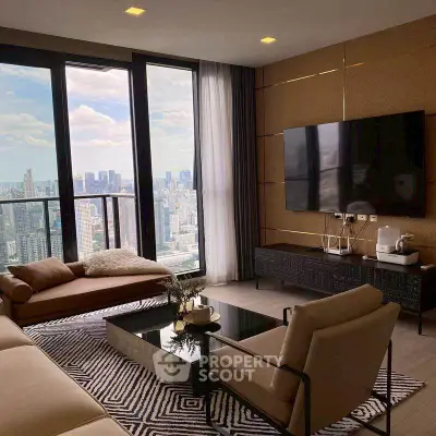 Luxurious living room with stunning city view, modern furniture, and large TV in high-rise apartment.
