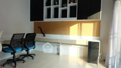 Modern study room with sleek desk and ergonomic chairs, perfect for productivity and comfort.