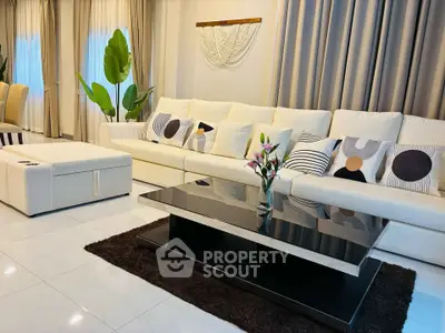 Elegant living room with modern white sofa and stylish decor