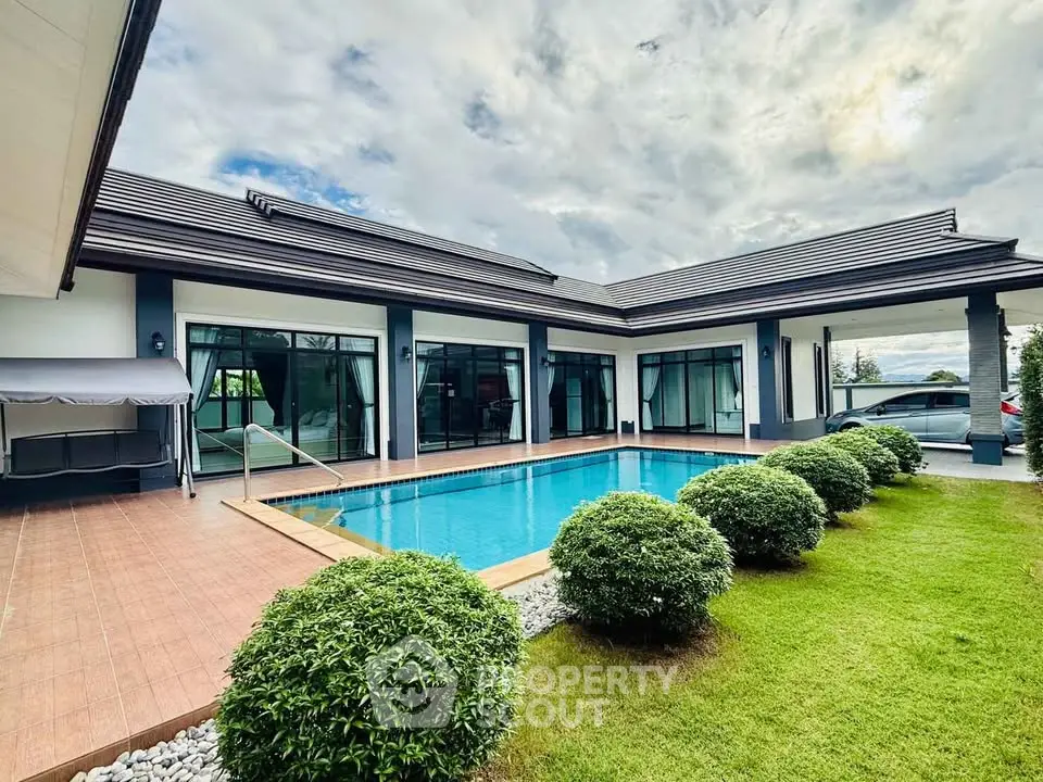 Luxurious modern home with private pool and lush garden, perfect for relaxation and entertaining.