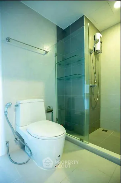 Modern bathroom with sleek shower and toilet design