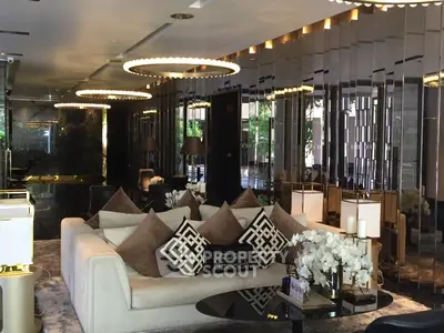 Luxurious modern living room with elegant decor and plush seating in a high-end property.