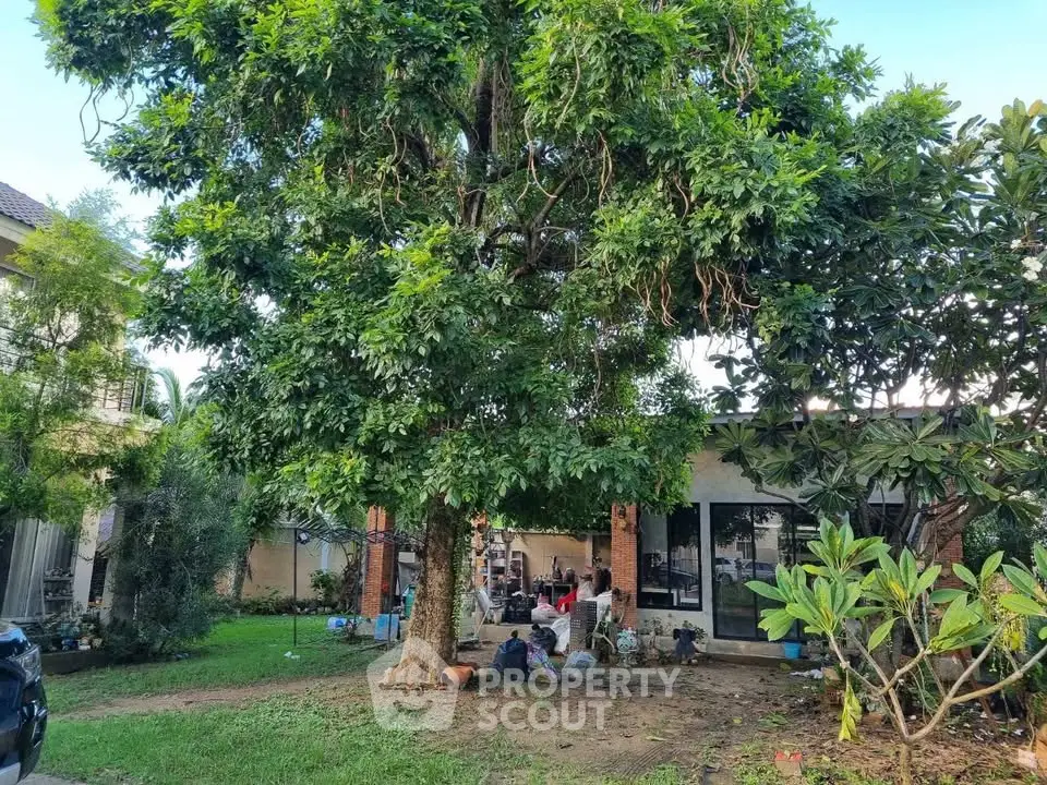 Charming garden view of a cozy home with lush greenery and spacious outdoor area.