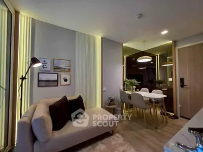 Modern living room with stylish decor and dining area in a cozy apartment.