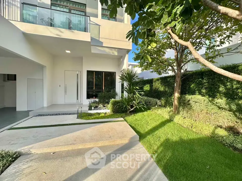 Modern house exterior with lush garden and sleek architecture