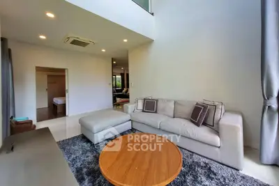 Spacious modern living room with cozy sofa and elegant decor
