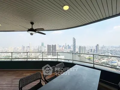 Stunning high-rise balcony with panoramic city and river views, perfect for urban living.