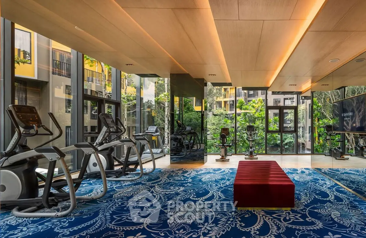 Luxurious gym with modern equipment and scenic garden views