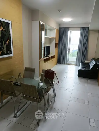 Modern living room with dining area and balcony view in stylish apartment